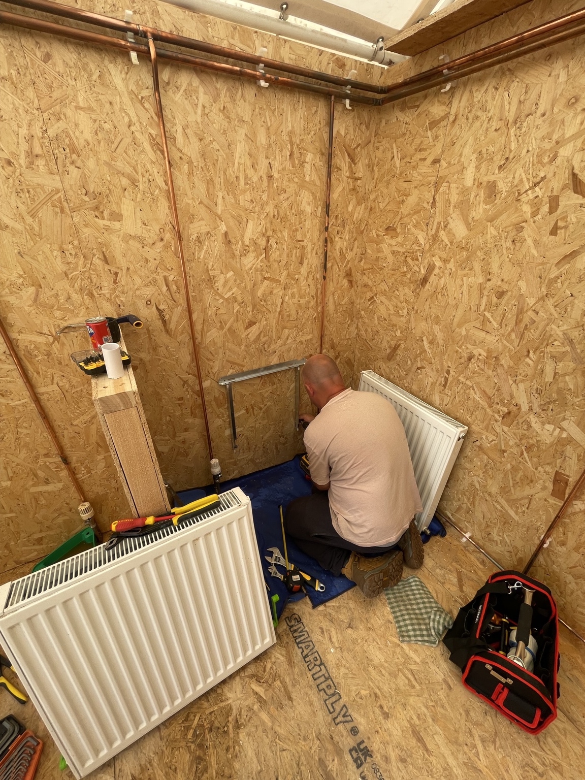 Student working on radiator pipework during the 3-day complete plumbing course